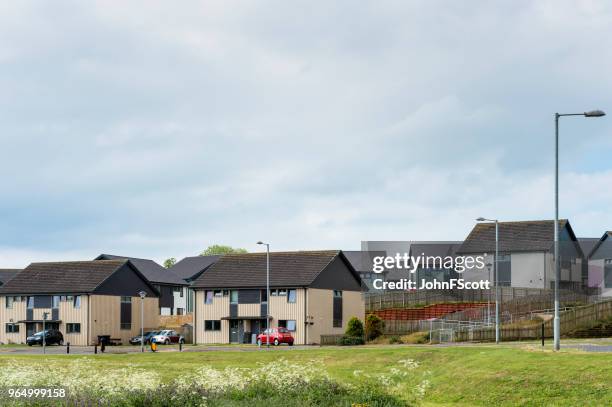 social housing on the outskirts of a scottish town - johnfscott stock pictures, royalty-free photos & images