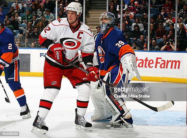 Eric Staal of the Carolina Hurricanes skates against Rick DiPietro of the New York Islanders on January 6, 2010 at Nassau Coliseum in Uniondale, New...
