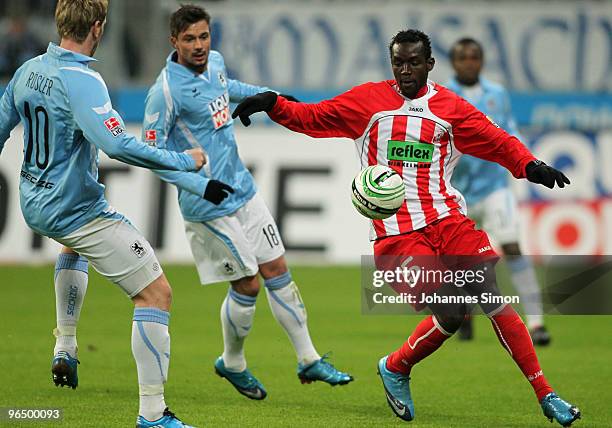 Sascha Roesler and Alexander Ludwig of Muenchen battles for the ball with Momar N'Diaye of Ahlen during the Second Bundesliga match between 1860...