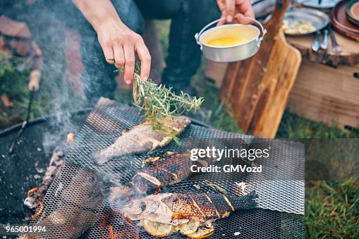 Preparing Fish for Cooking Over Open Campfire Preparing Fish for Cooking Over Open Campfire