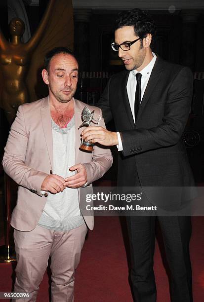 Sacha Baron Cohen with The Peter Sellers Award For Comedy with Dan Mazer attend the London Evening Standard British Film Awards 2010, at The London...