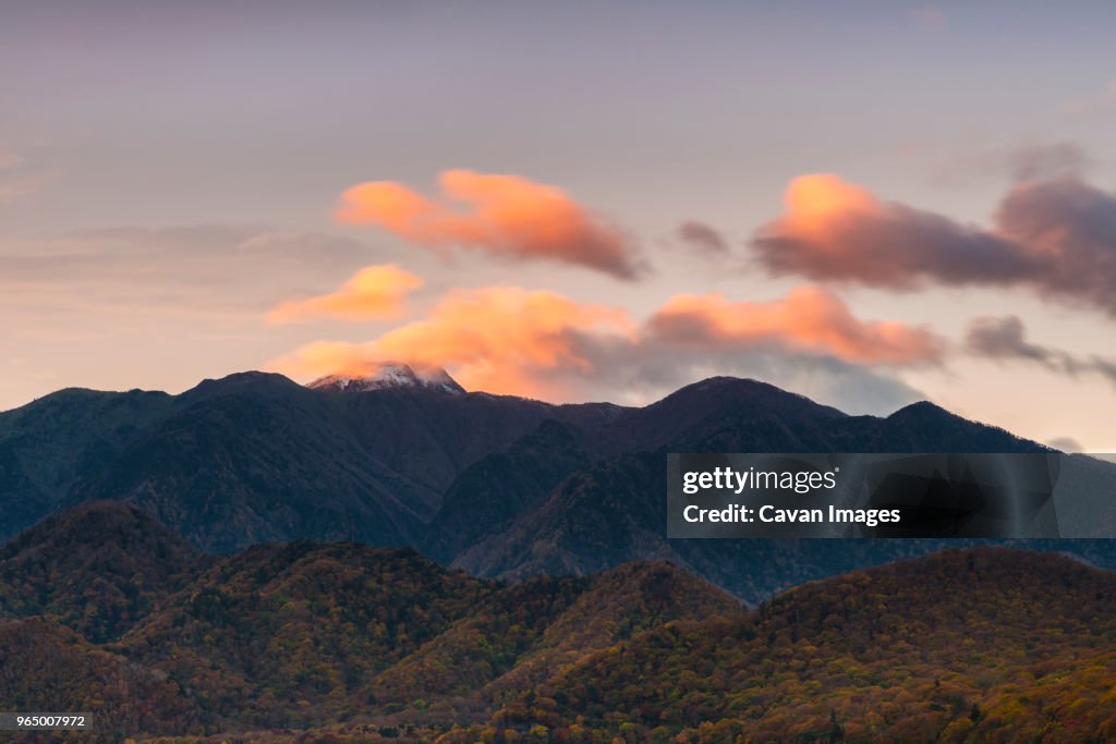 Scenic view of Mt Nikko-Shirane against sky during sunset