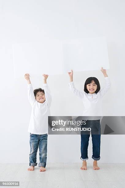 child with family - asian kid raising hand stock pictures, royalty-free photos & images