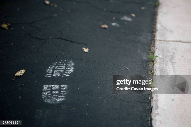 close-up of shoe print on road - shoe print stock pictures, royalty-free photos & images