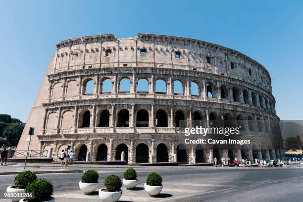 view of colosseum against clear sky - rome colosseum stock pictures, royalty-free photos & images
