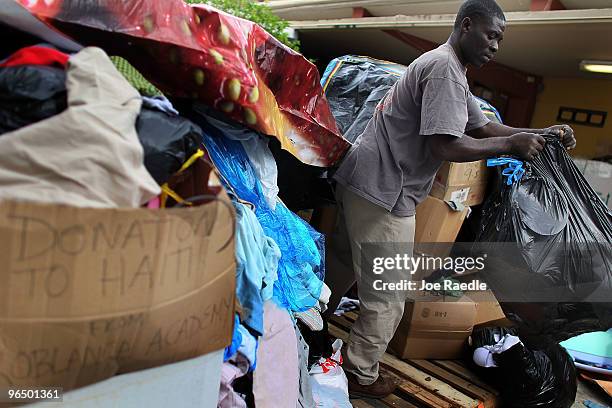 Samuel Petie sorts through donated items at the Notre Dame d'Haiti Catholic Center where they continue to collect items to be shipped to Haiti for...