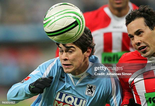 Emanuel Biancucchi of Muenchen heads for the ball with Tim Gorschlueter of Ahlen during the Second Bundesliga match between 1860 Muenchen and Rot...