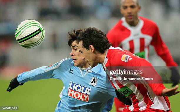 Emanuel Biancucchi of Muenchen heads for the ball with Tim Gorschlueter of Ahlen during the Second Bundesliga match between 1860 Muenchen and Rot...