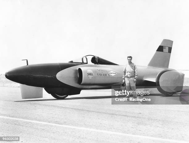 Craig Breedlove poses with his "Spirit of America" car. Breedlove became the first driver to go over 500 mph on land with this car in '64.