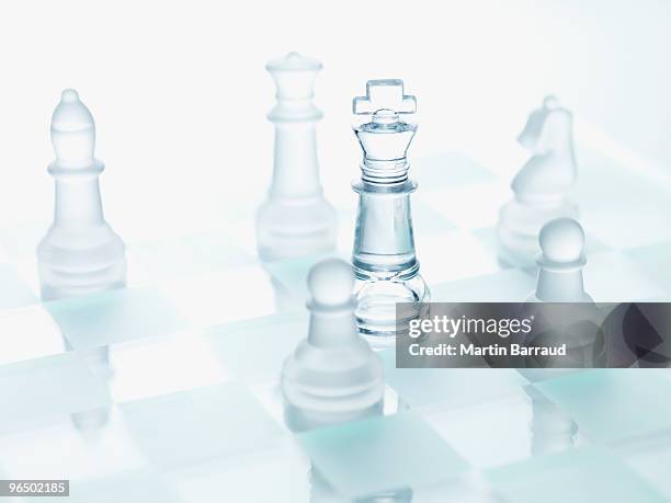 close up of glass chess pieces - chess board stock pictures, royalty-free photos & images