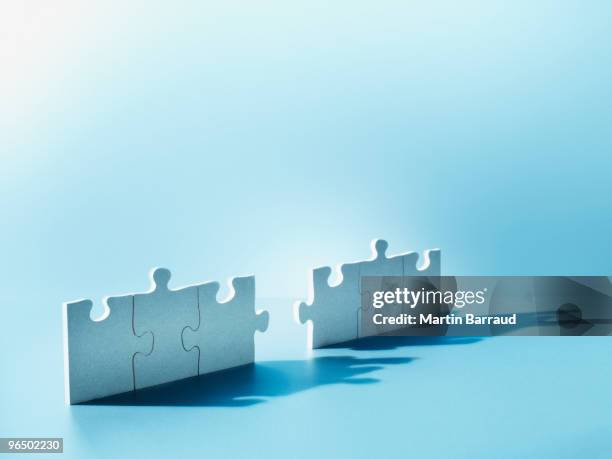 jigsaw puzzle pieces standing on end - incomplete bildbanksfoton och bilder