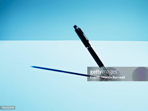fountain pen casting shadow - pen stock pictures, royalty-free photos & images