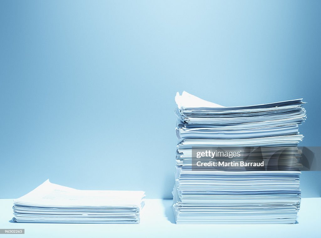 Tall and short stacks of paper