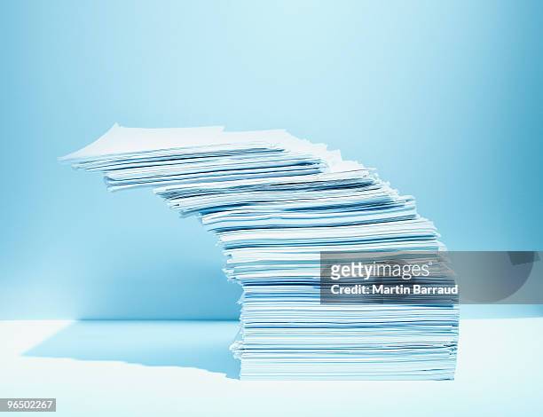 stack of paper piled precariously - large group of objects stock pictures, royalty-free photos & images