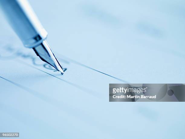 tip of fountain pen writing - contract stock pictures, royalty-free photos & images