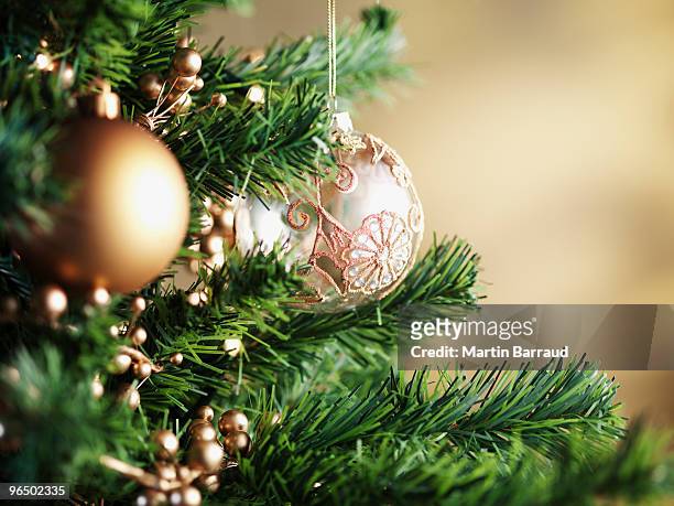 close up of christmas ornaments on tree - christmas tree close up stock pictures, royalty-free photos & images