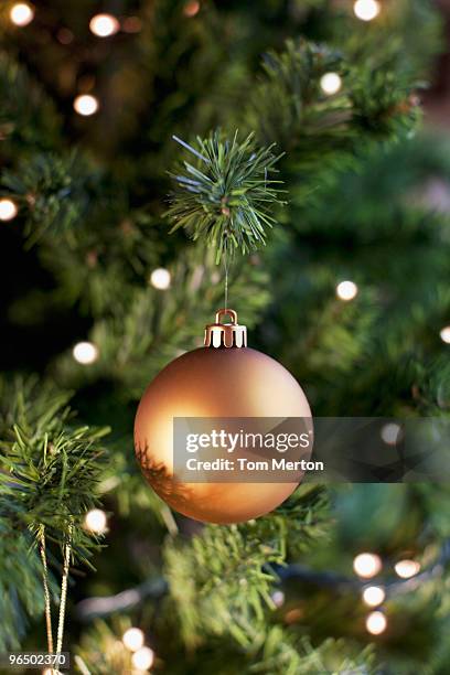 close up of christmas ornament on tree - christmas ornaments stockfoto's en -beelden