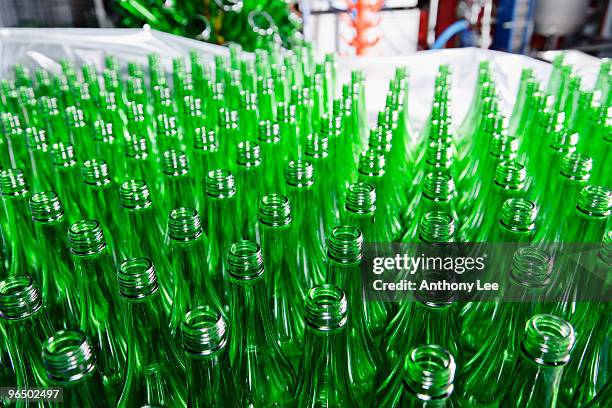large group of green bottles - bottling plant stock pictures, royalty-free photos & images