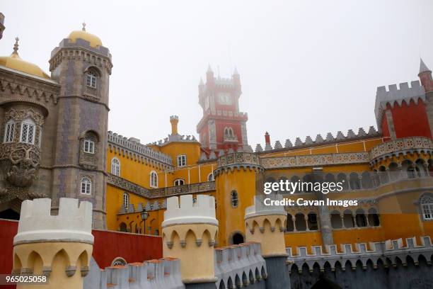 low angle view of palacio da pena against clear sky - sintra palace stock pictures, royalty-free photos & images