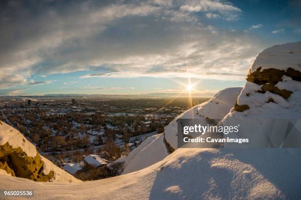 scenic view of townscape against cloudy sky during winter - billings montana fotografías e imágenes de stock