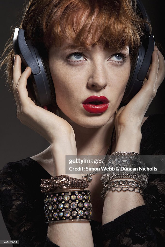 Woman listening to headphones