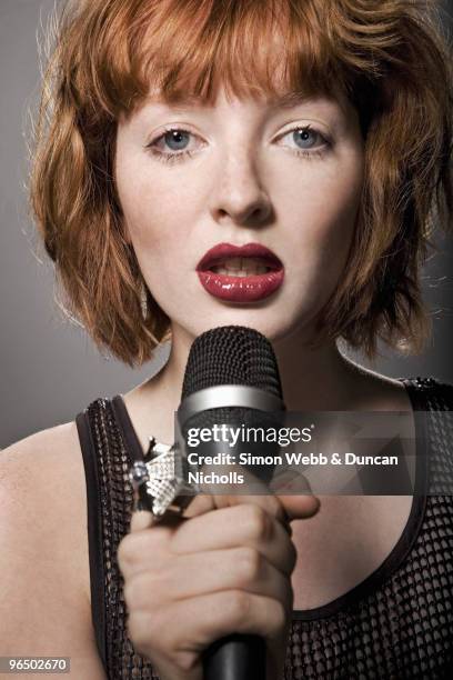 Red Tips Singer 6,557 Red Head Singers Stock Photos, High-Res Pictures, and Images ...