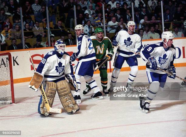 Allan Bester, Tom Kurvers, Al Iafrate and Dave Hannan of the Toronto Maple Leafs skate against Brian Bellows of the Minnesota North Stars during NHL...