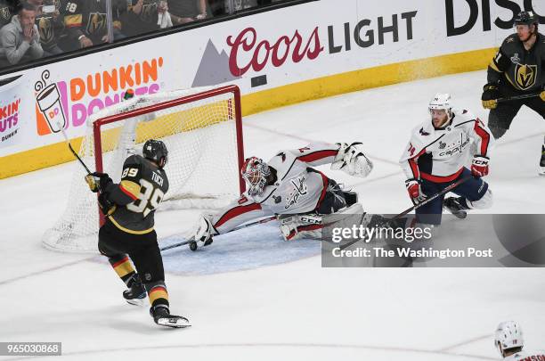 Washington Capitals goaltender Braden Holtby makes a great save against Vegas Golden Knights right wing Alex Tuch late in the third period of Game 2...