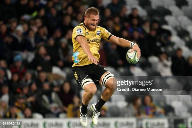 Brad Shields of the Hurricanes makes his way out on field for his 100th match during the round 16 Super Rugby match between the Highlanders and the...