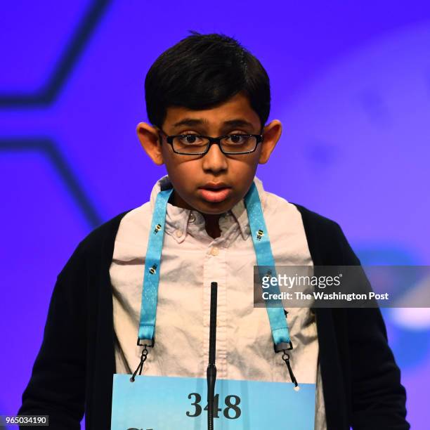 Christopher Serrao listens the definition and pronunciation of the word grunion which he misspelled at the 91st Scripps National Spelling Bee is...