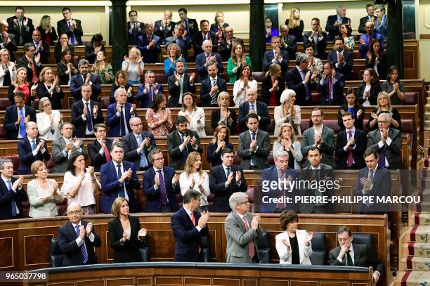 Spanish Prime Minister Mariano Rajoy acknowledges applause from Popular Party's deputies during a debate on a no-confidence motion at the Lower House...