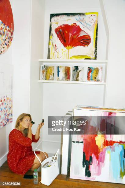 Painter Caroline Faindt and her companion actor Zinedine Soualem attend Caroline Faindt Painting Exhibition at Galerie Louis Dort on May 31, 2018 in...