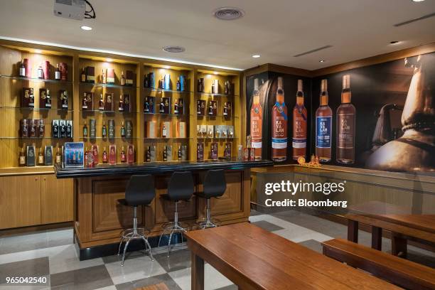 Bottles of whisky stand on display in the tasting room at the Kavalan Single Malt Whisky distillery in Yilan County, Taiwan, on Thursday, Jan. 25,...