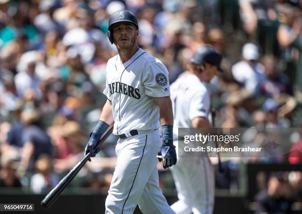 Chris Herrmann of the Seattle Mariners walks off the field after an at-bat in a game against the Minnesota Twins at Safeco Field on May 27, 2018 in...