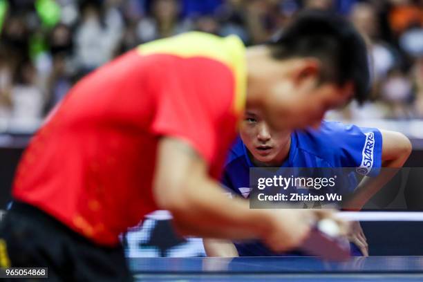 Harimoto Tomokazu of Japan in action at the men's singles match compete with Zhang Jike of China during the 2018 ITTF World Tour China Open on June...