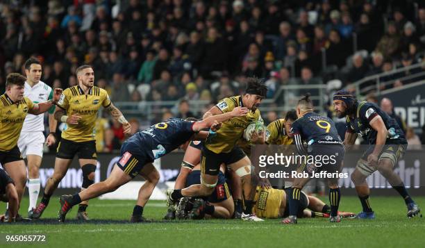 Ardie Savea of the Hurricanes on the attack during the round 16 Super Rugby match between the Highlanders and the Hurricanes at Forsyth Barr Stadium...