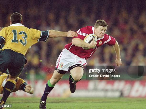 Brian O''Driscoll of the British Lions goes past Daniel Herbert of Australia during the British and Irish Lions tour match against Australia played...