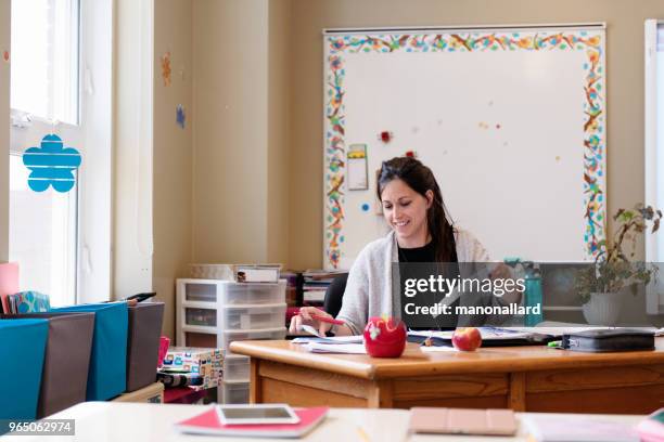 teacher in a classroom without students at school's out. - teacher school supplies stock pictures, royalty-free photos & images