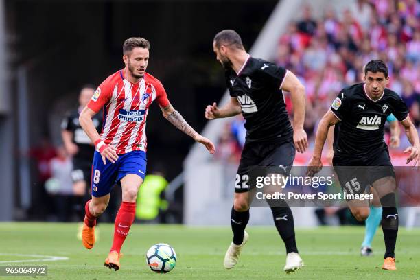 Saul Niguez of Atletico de Madrid in action against David Lomban of SD Eibar during the La Liga match between Atletico Madrid and Eibar at Wanda...