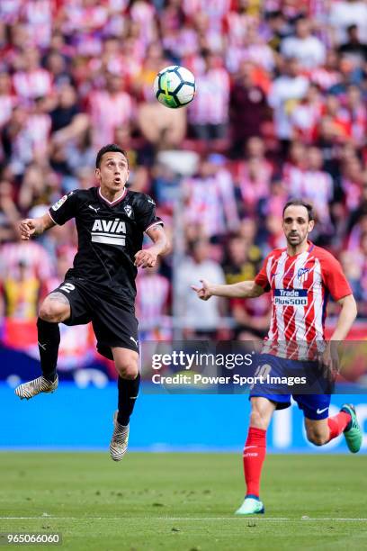 Fabian Orellana of SD Eibar plays against Juanfran Torres of Atletico de Madrid during the La Liga match between Atletico Madrid and Eibar at Wanda...