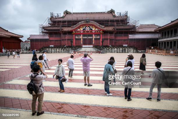 Tourists visit Shuri Castle on June 1, 2018 in Naha, Japan. Like the rest of Japan, the southern island of Okinawa has seen a recent surge in tourist...