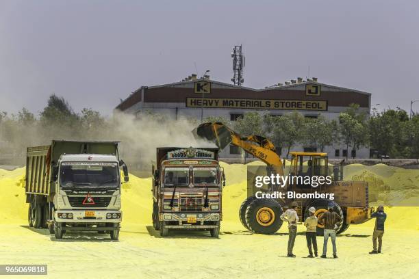 An excavator loads sulfur into trucks at the Vadinar Refinery complex operated by Nayare Energy Ltd., formerly known as Essar Oil Ltd. And now...