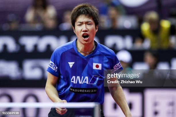 Mizutani Jun of Japan in action at the men's singles match compete with Franziska Patrick of Germany during the 2018 ITTF World Tour China Open on...
