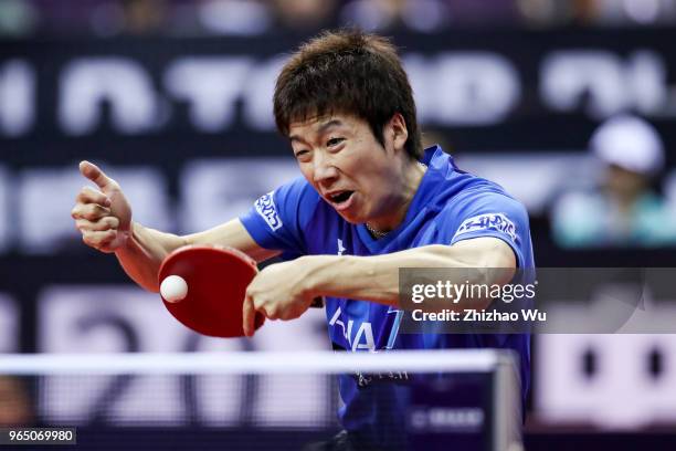 Mizutani Jun of Japan in action at the men's singles match compete with Franziska Patrick of Germany during the 2018 ITTF World Tour China Open on...