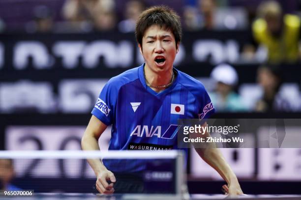 Mizutani Jun of Japan in action at the men's singles match compete with Franziska Patrick of Germany during the 2018 ITTF World Tour China Open on...