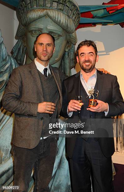 Jesse Armstrong and Simon Blackwell with the Best Screenplay Award for 'In The Loop' attend the London Evening Standard British Film Awards 2010, at...