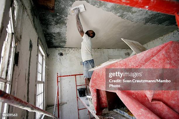 Cuban workers restore the ceiling of Ernest Hemingway�s house at the Finca Vigia, on March 29, 2006 in Havana, Cuba. The Hemingway Finca Vigia, now...