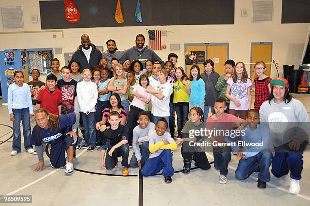 Nene, Johan Petro, Renaldo Balkman and Strength and Conditioning Coach Steve Hess of the Denver Nuggets pose for a photo with students at Palmer...
