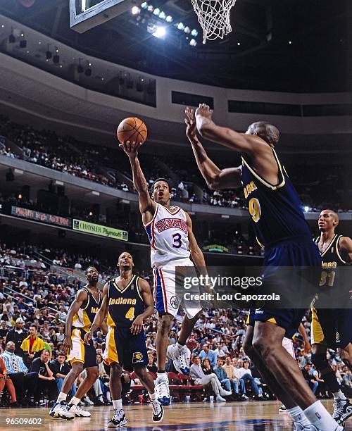 Allen Iverson of the Philadelphia 76ers shoots a layup against the Indiana Pacers in 1997 at the First Union Center in Philadelphia, Pennsylvania....