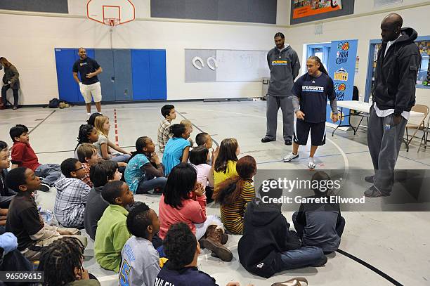 Nene, Strength and Conditioning Coach Steve Hess and Johan Petro of the Denver Nuggets visit with students at Palmer Elementary as part of the Denver...